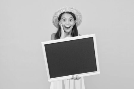 Advertising for beginners. Surprised girl hold school blackboard. Advertising for private school. Advertising and promoting. Advertisement. Advertising message to get more new customers, copy spaceの写真素材