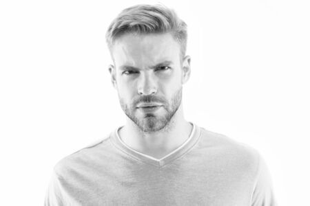 Allowing beard to grow for sexy reasons. Unshaven man isolated on white. Serious guy with unshaven stubble. Unshaven model with short facial hair. Beard hair products. Shaving salon. Barbershopの写真素材