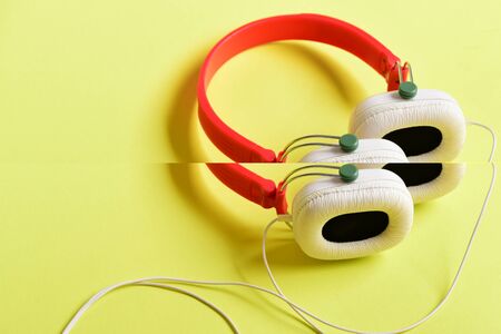 Headphones in white and red color with long wireの写真素材