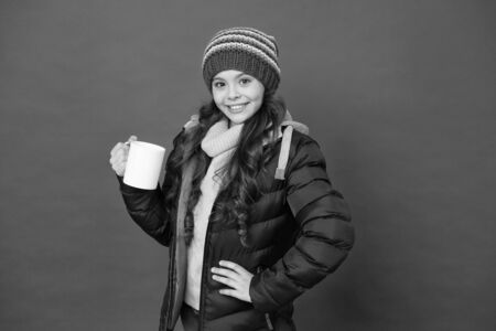 Protein cocktail. Happy child enjoy drinking tea or coffee. Little girl hold drinking mug. Healthy drinking habits. Drinking cocoa or chocolate. Hot drink. Winter holidays. Morning breakfast conceptの写真素材