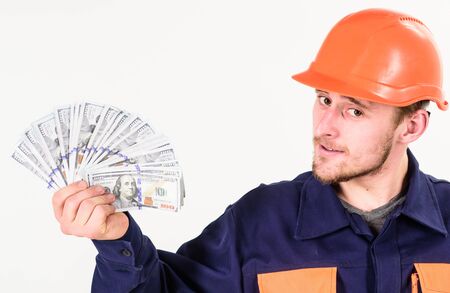 Handyman with strict face in hard hat on white background.の写真素材