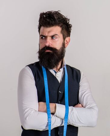 Man with beard and mustache holds hands crossed.の写真素材