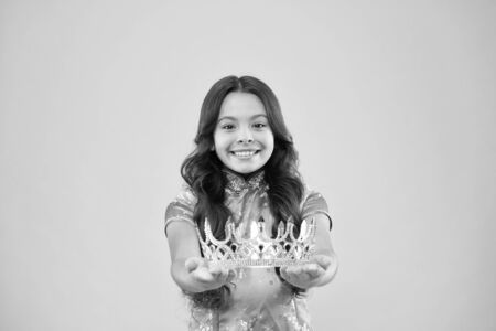 Winner of beauty competition. International beauty contest. Kid wear golden crown symbol of princess. Become princess. Lady little princess. Girl wear crown. Princess manners. Award conceptの写真素材