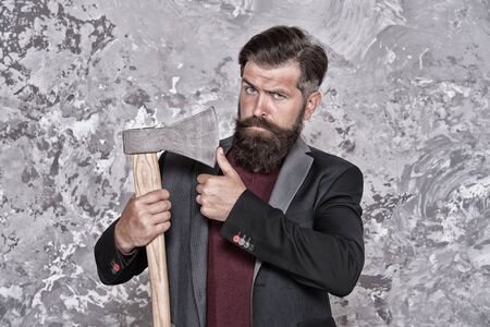 Retro shaving. Bearded man hold sharp axe. Retro razor blade. Brutal hipster abstract background. Retro barbershop. Barber shop. Classic shave. Hair salon. Retro and dangerous, vintage filterの写真素材