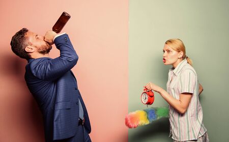 woman clean house. housekeeping business. wife wondering why husband reveler came home so late. cleaning service. family routine. relations problems. segregation of duties. man alcoholic drink wine.の写真素材