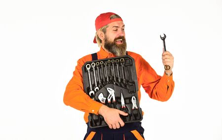 What to Carry in Your Car Toolbox. Man in uniform carries toolbox white background. Worker repairer repairman handyman carrying toolbox. Handyman concept. Professional equipment. Really good toolsの写真素材