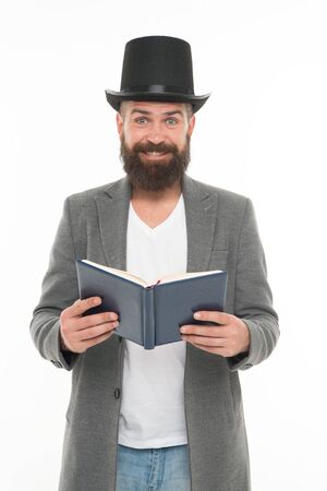 Funny stories. Comedian guy. Hilarious comedy for someone else might be drama. Sense of humor. Smiling hipster with book. Reading jokes. Comedy concept. Comedy actor. Man in top hat and jacketの写真素材
