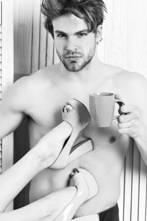 Caucasian bearded sexy macho holding coffee cupの写真素材