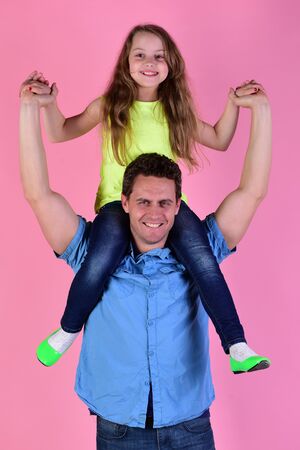 Girl and man with cheerful faces on pink backgroundの写真素材