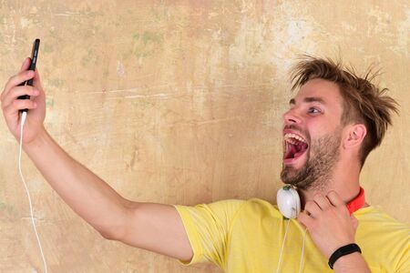 American handsome bearded guy with headphones.