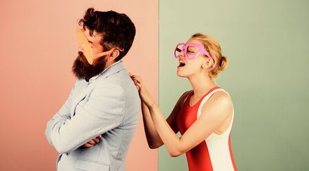 Catch my wave. Party vibes. Couple having fun. Office party. Celebrating success. Relax and have fun. Corporate culture. Celebrating holiday. Bearded man pretty woman party goggles celebrating.の写真素材