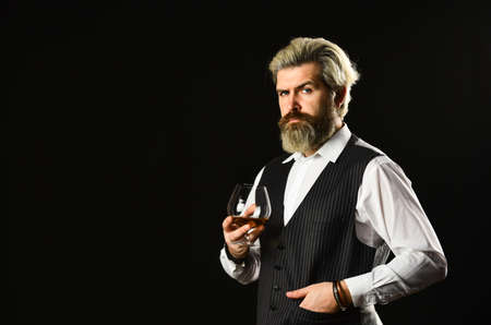Matured in sherry casks. Whisky tasting. Good indication of condition of whisky. Bearded businessman...