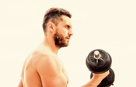 Price of greatness is responsibility. Dumbbell exercise gym. Muscular man exercising with dumbbell. Sportsman with strong torso. Gym equipment. Fitness and bodybuilding sport. Gym workout conceptの写真素材