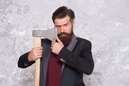 Easy way to style his moustache. Brutal hipster hold axe. Bearded man with stylish moustache....