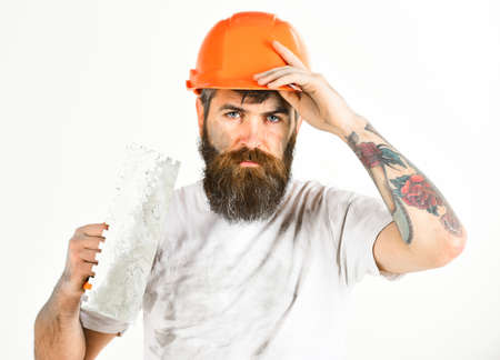 Brutal repairman concept. Bearded repairman with tired faceの写真素材