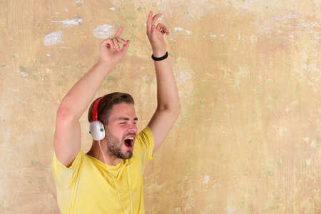 Musical lifestyle. Blue eyed stylish hipster with smartphone.の写真素材