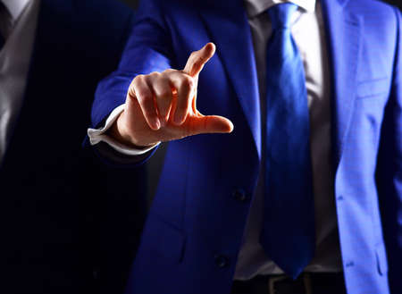 Man touching screen. Businessman pressing touchscreen button.の写真素材