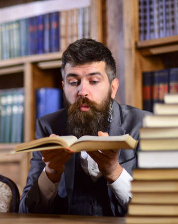 Treasures of science concept. Man with beard in classic suit