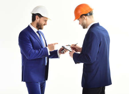 Entrepreneur and architect look confident. Construction, engineering, finance concept.の写真素材