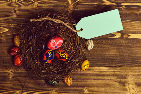 set with colorful eggs inside nest. Happy Easter concept