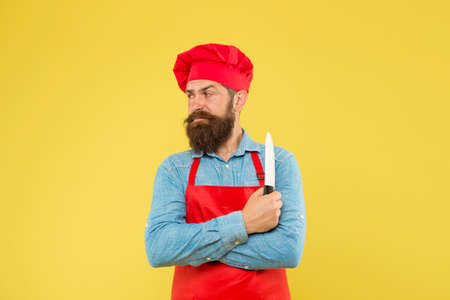 Lets cook it. brutal male cook in hat and apron. professional man cooking. restaurant cuisine and...