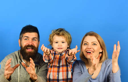 Man with beard, woman and boy play on blue background