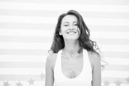 Curly hairstyle instantly make you feel lighter and more relaxed during summertime. Woman pretty...