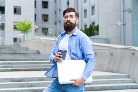 Go ahead for break. Hipster hold takeaway cup and laptop. Coffee break. Hot drink. Morning break....