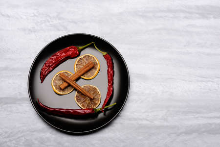 black ceramic plate with ingredients on itの写真素材