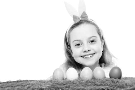 small happy baby girl with easter eggs isolated on white