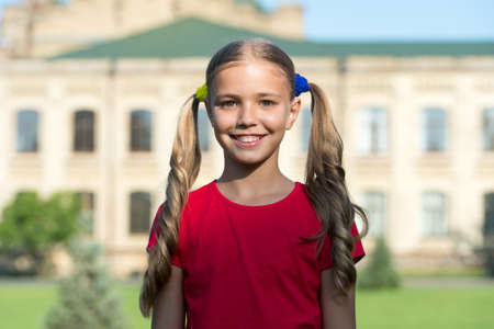 Alive every moment. Happy child smile sunny outdoors. Little child in summer style. Beauty look of...