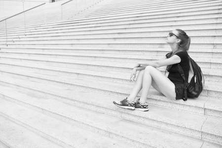 Follow your dream it knows way. Tired traveler relax on stairs. Pretty girl dream and fantasy. Cute dreamer sit on stone steps. Success and ambitions. Dream vacation. Dream doesnt work until you doの写真素材