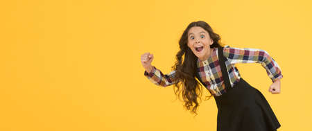 Tips for healthy hair. Towards the wind. Girl kid long hair flying in air. Growing hair. Natural...
