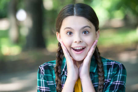 Essence of skincare. Happy girl smile outdoors. Natural skincare. Beauty look of little child. Summer skincare routine. Baby skin care cosmetics. Youll love what you seeの写真素材