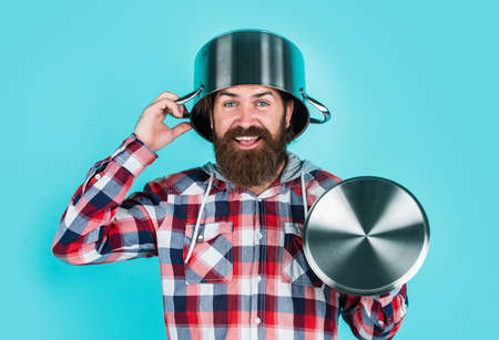 feel protected. bearded man hold kitchen pan. brutal hipster cooking with saucepan. housekeep...