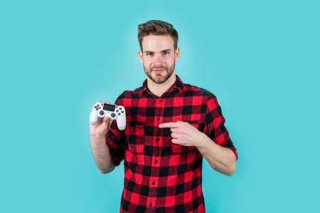 video games addicted young guy play with console. man playing video game with controller. bearded man using virtual reality gamepad. new videogame online. adult entertainmentの写真素材