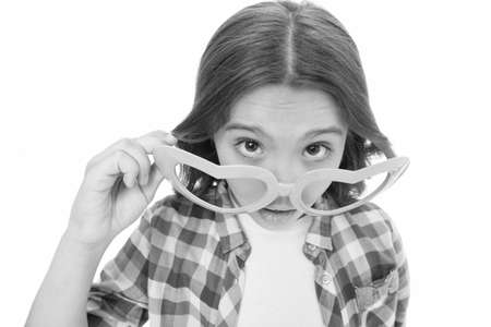 Go cute and fun. Valentines girl with party look isolated on white. Small child in heart shaped glasses. Valentines day party. Fashion accessory for Valentines day. Fashion and beauty. Valentines dayの写真素材