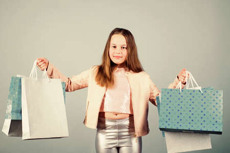 Little girl with bunch packages.の写真素材