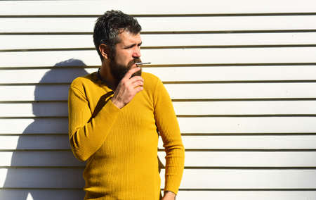 Bad habit and unhealthy lifestyle concept. Man with serious faceの写真素材