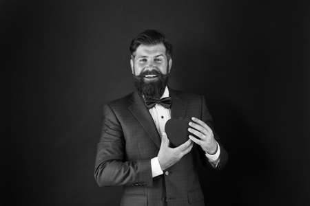 Heart of business life. More physical activity. Healthy heart. Man bearded hipster hold red heart. Health care concept. Check helps understand risk factors for heart disease. Stressful occupationの写真素材