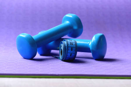 Shaping and fitness equipment. Dumbbells and measure tape