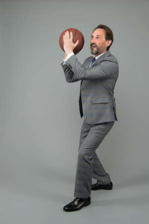 Businessman warm up with basketball in office, prepare to throw conceptの写真素材