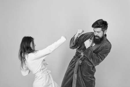 Couple in love bathrobes. Drowsy and weak in morning. Advice relationships surviving quarantine. Morning routine. Couple sleepy faces domestic clothes. All day pajamas. Sleepy people blue backgroundの写真素材