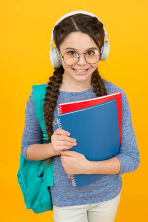 Happy kid wear headphones. English learning courses. Lの写真素材