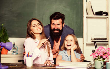 Individual approach. Tutor for excellence. Extra classes. Gifted child. Little girl studying with...