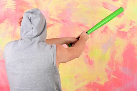 Male arms with athletic muscles on colorful background