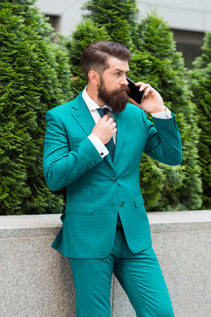 Business call. Stylish guy wear tuxedo.の写真素材