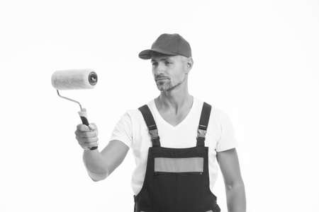 Interested in design and decor. Interior decorator isolated on white. Painter decorator hold paint roller. Skilful decorator or handyman. Painting and decorating work. House decoratorの写真素材
