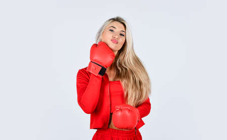 Elastic skin. Use collagen for firmness. Face massage. Beauty salon. Cosmetology beauty procedure. Wrinkles treatment. Woman boxing gloves. Sport girl. Fitness trainer. Facial skin. Skin careの写真素材