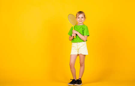 Tennis club for kids. Tennis player with racket. Childhood activity. Fitness brings health and energy. Gym workout of teen girl. Sport game success. Happy child play tennis. Tennis trainingの写真素材